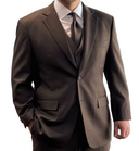 A man wearing brown suit and trousers with a white shirt and matching colour tie.