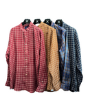 Four plaid long sleeve shirts in red, yellowish-brown, blue and dark navy.