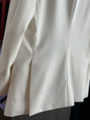 Close-up of a white wool blend tuxedo jacket near Bukit Bintang.