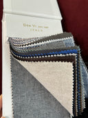 Textured fabric swatches in various colors with 'Den Vi' branding.