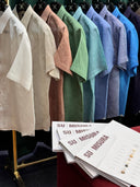 Row of colorful shirts on hangers located near pavilion bukit bintang.
