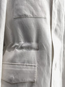 Close-up of WH Bespoke Anniversary special jacket with two front pockets and adjustable waist line.