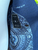 Wide peak lapels on a bespoke navy jacket tailored in Kuala Lumpur