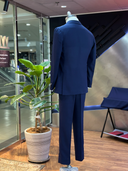 Three-button navy jacket with a natural lapel roll