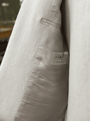 Double forward pleats on natural stone linen trousers