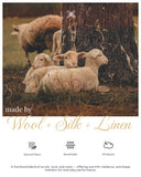 Sheep under a tree with text about made by Wool + Silk + Linen