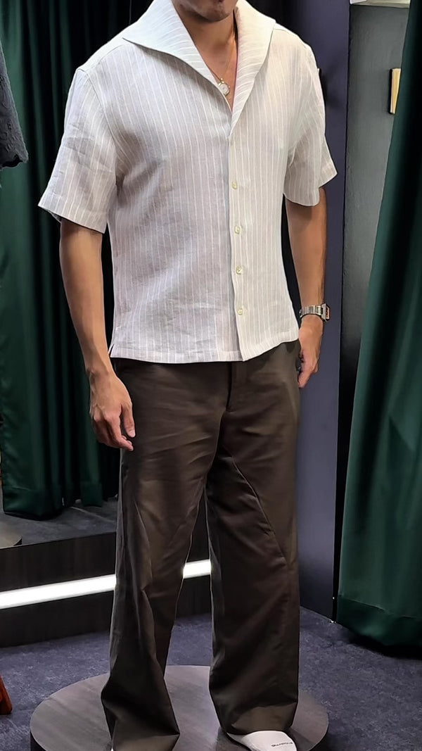 Video of a man wearing his bespoke shirt, very satisfied with the outcome.