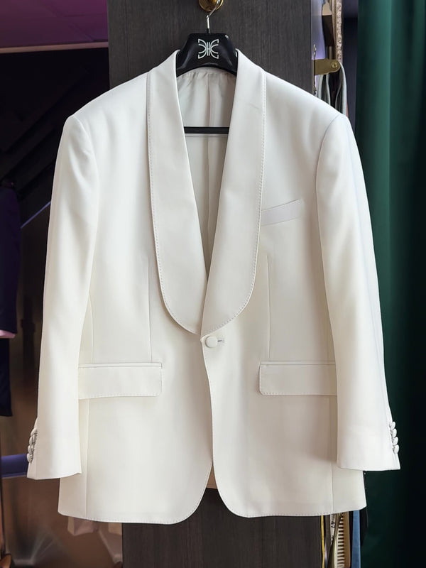 Video of a white bespoke suit jacket tailored in KL. Premium wool blend, Bemberg lining, and refined structure for timeless elegance.