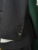 Close-up of a dark suit jacket with sleeve buttons made with horn