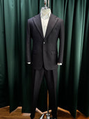 Black suit and trousers in a bespoke tailor store located in malaysia