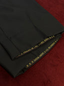 Black trousers with gold text details near klcc